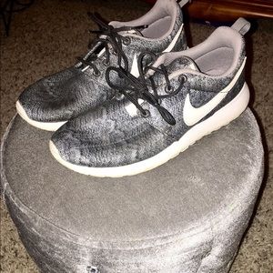 Grey and Black patterned Nike Roshes